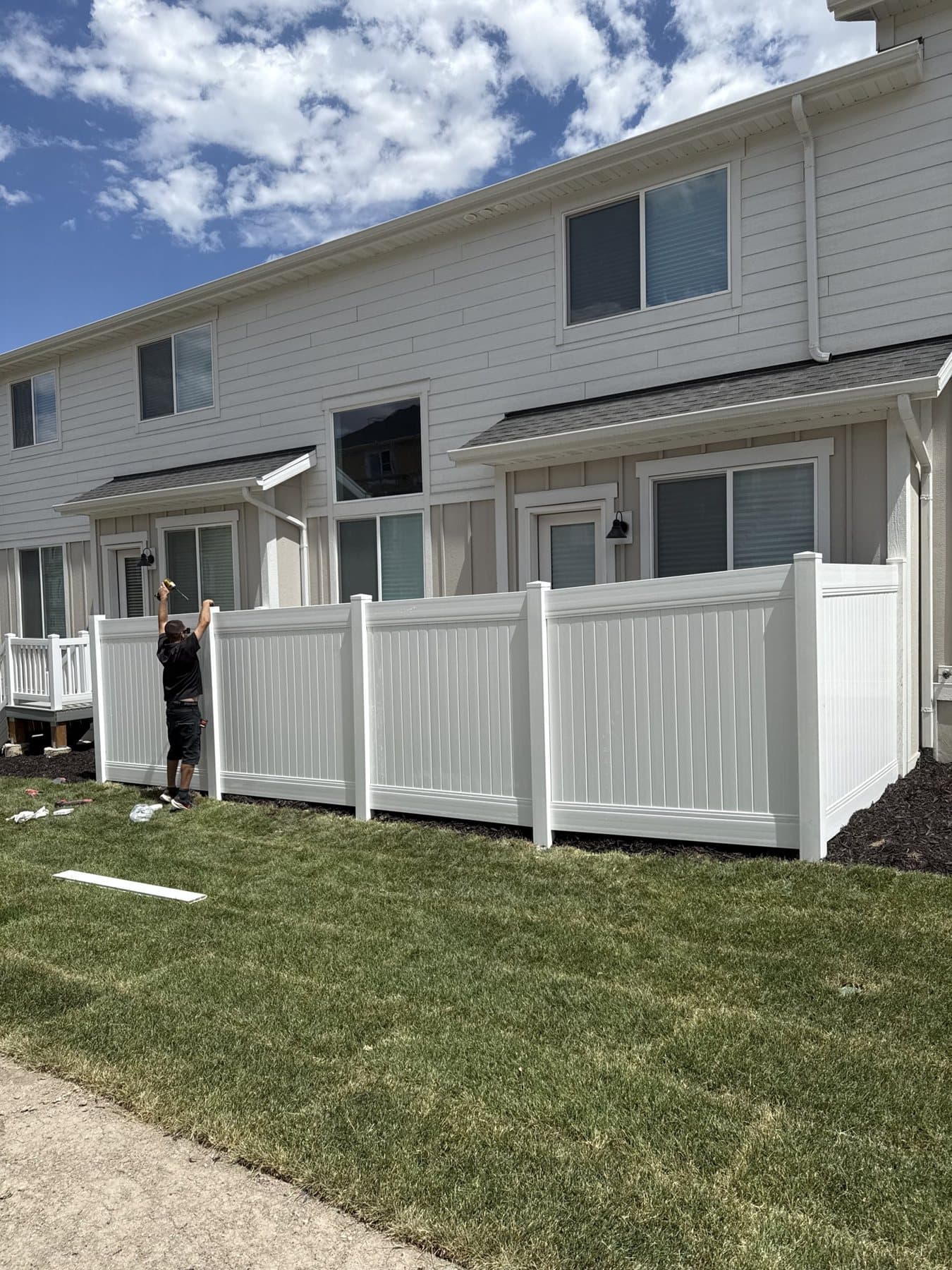 White vinyl privacy fence at new townhomes