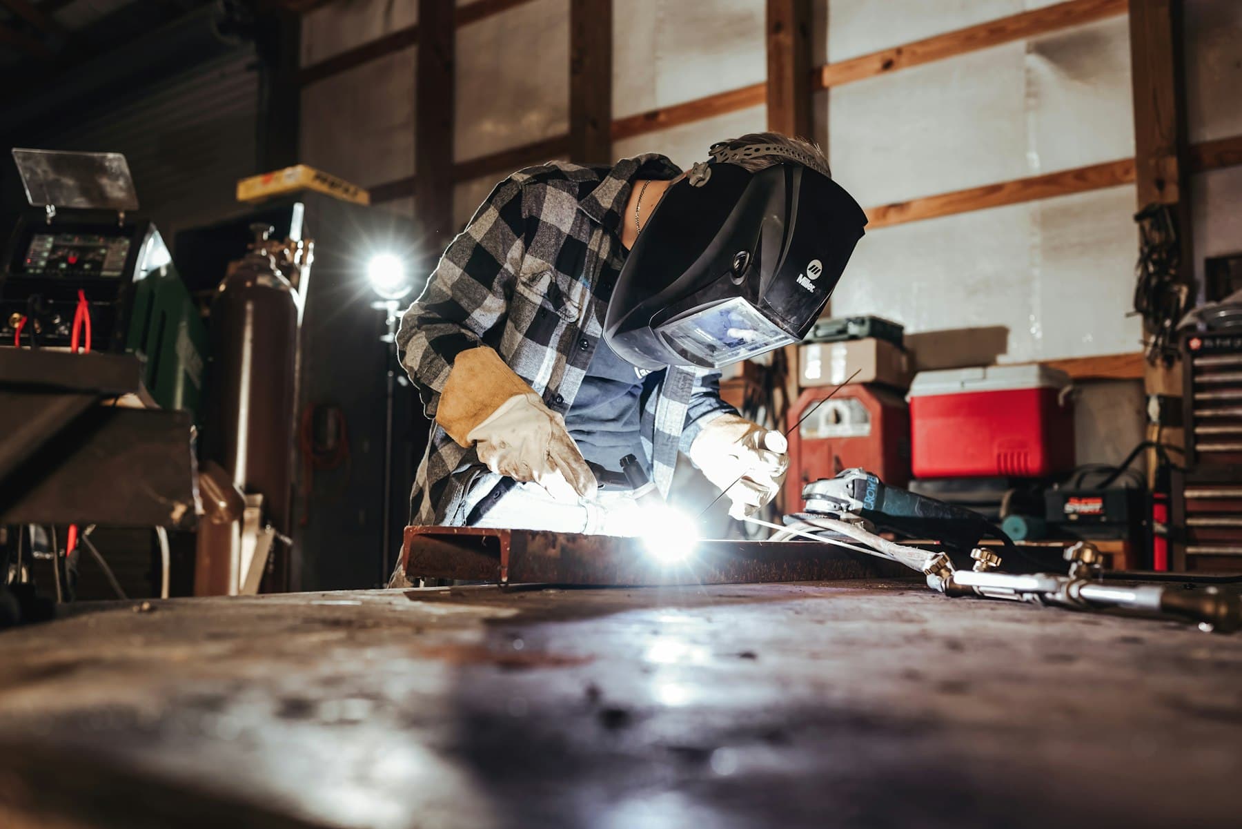Welder fabricating a custom metal piece