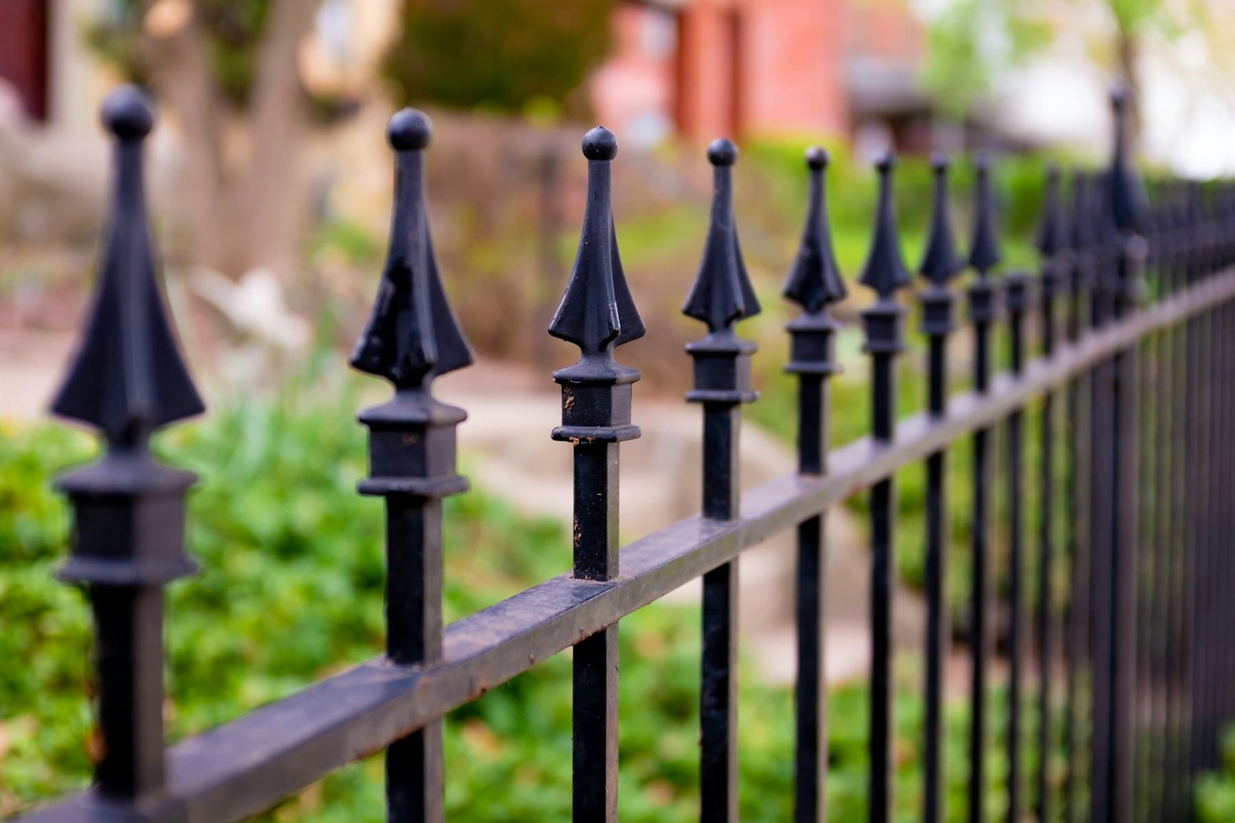 Black ornamental iron fence with spear tops